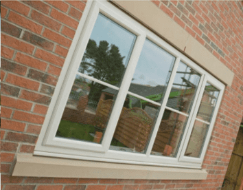 White casement window on a house corner
