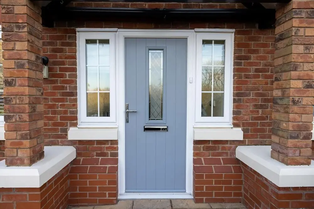 Blue-grey composite front door with sidelights