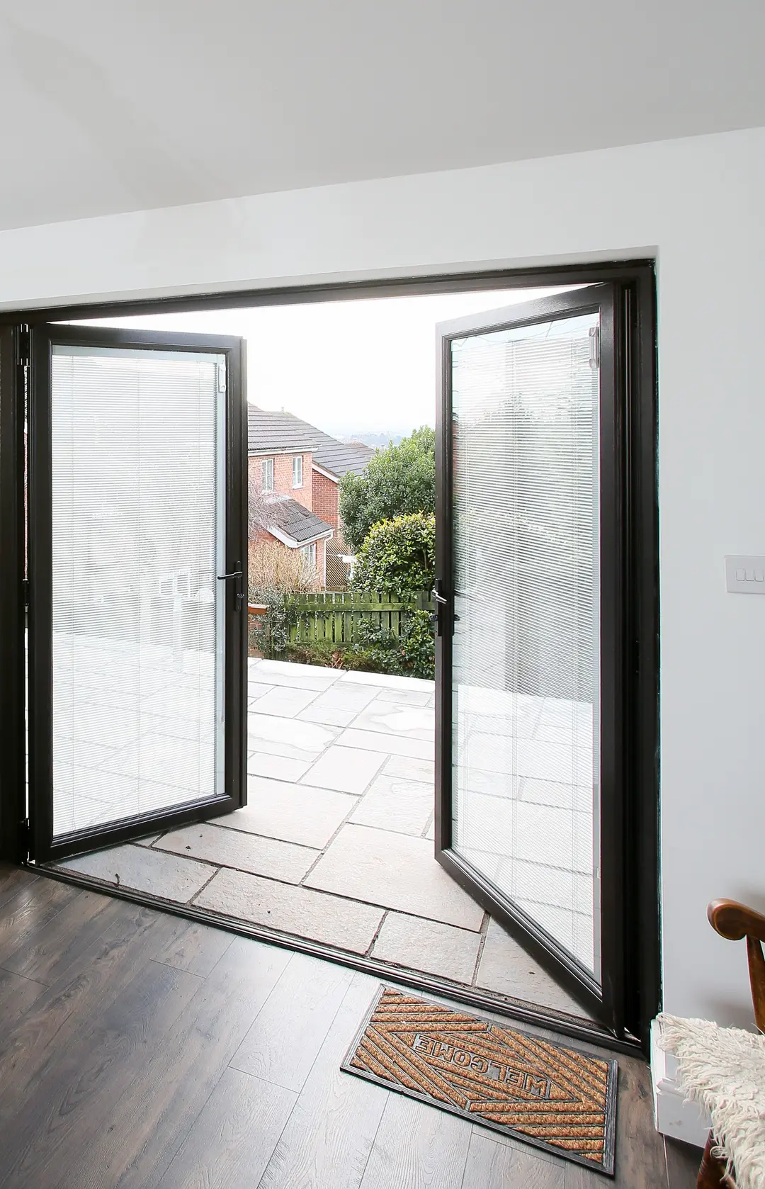 Aluminium French doors open onto a patio