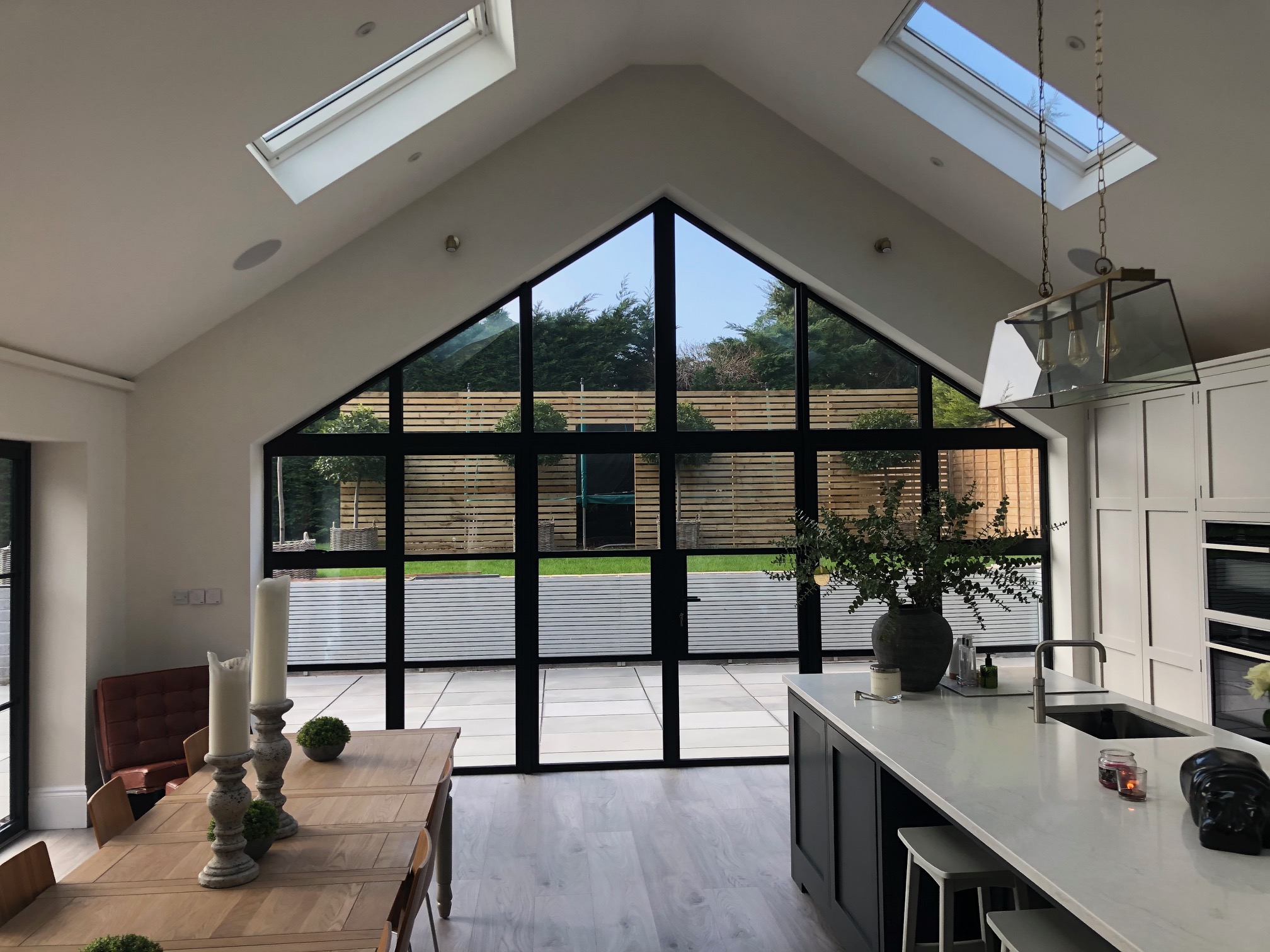 Barn conversion interior with vaulted gable-end window