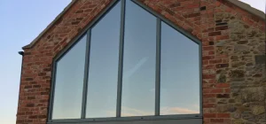 Close-up of grey aluminium gable-end window