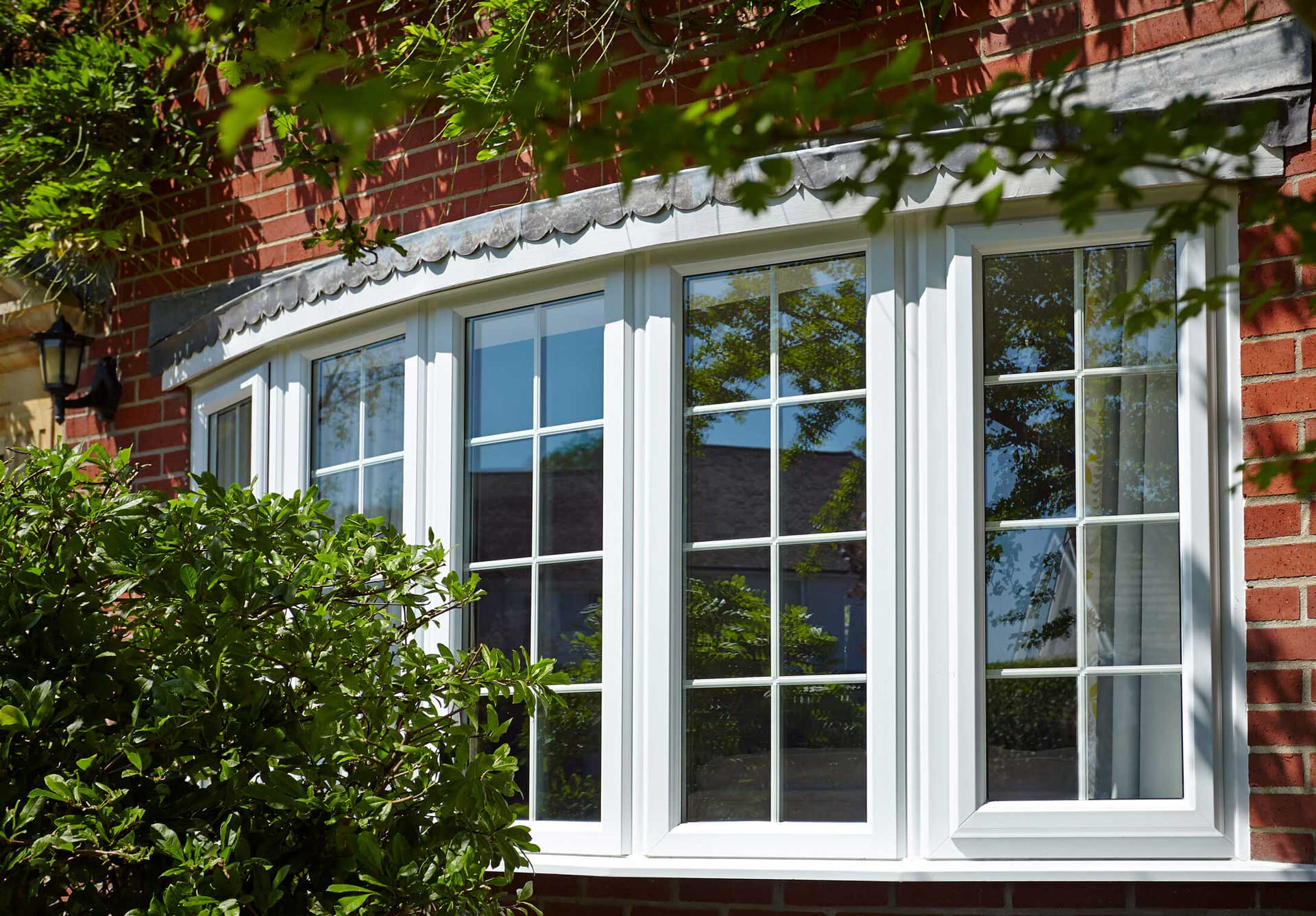 White uPVC bow window fitted to a red-brick Southampton home