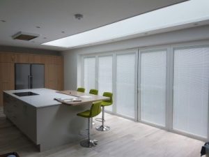 White bi-fold doors with integrated blinds, kitchen