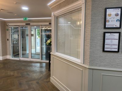Glass wall with integrated blinds in a reception area