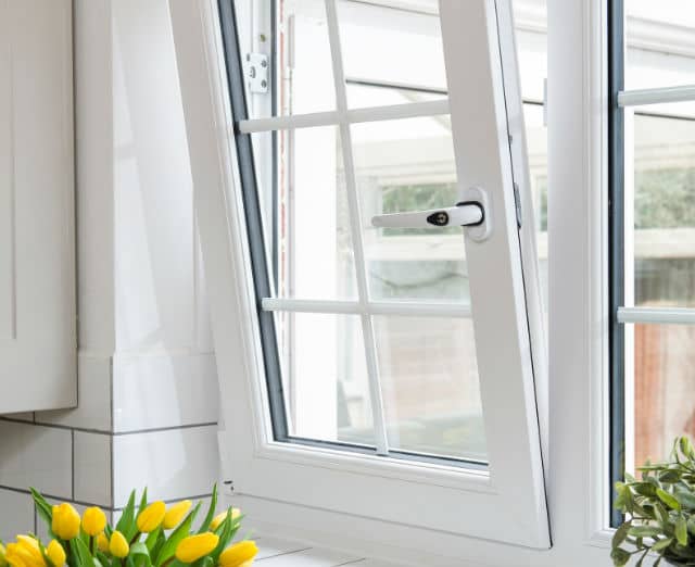 Close-up of a tilt and turn window opened on the tilt position