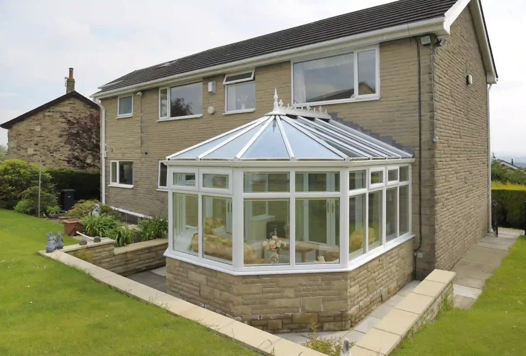 Victorian conservatory with five-sided bay front and ridge detail